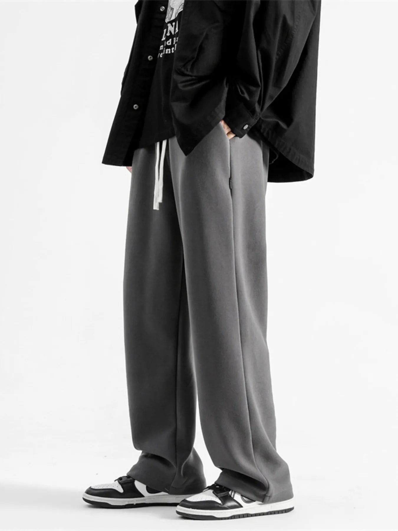Dark gray casual loose fit sweatpants with white drawstring and pockets.