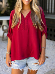 Braided V-neck half sleeve blouse in deep red with braided detail on neckline.