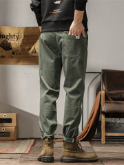 Men's plus size slim fit ankle pants in military green with a back pocket detail.