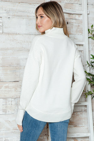 White ribbed knit funnel neck pullover sweater with long sleeves.