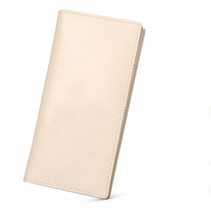 Sleek pebbled leather long wallet in cream with stitched edges.