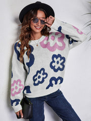 White acrylic crewneck sweater with navy and pink floral pattern.