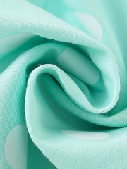 Baby dress in mint green cotton blend with white polka dots and ice cream applique detail.