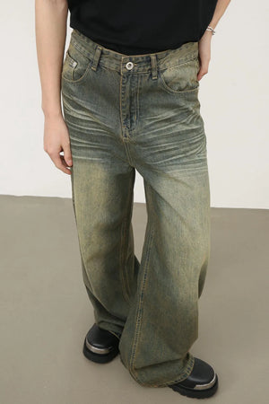 Vintage wash palazzo denim trousers in dark, featuring a relaxed fit and distressed details.