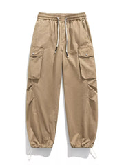 Khaki cargo pants with drawstring waist and adjustable cuffs.