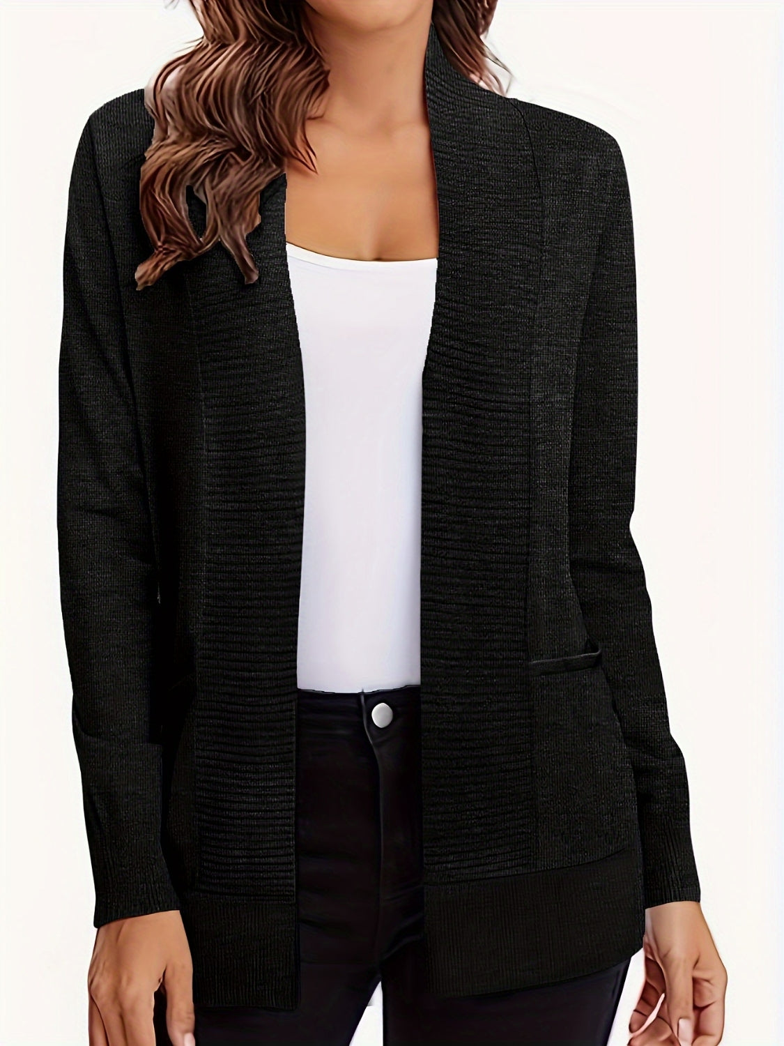 Black textured knit open-front cardigan with pockets and a draped collar.