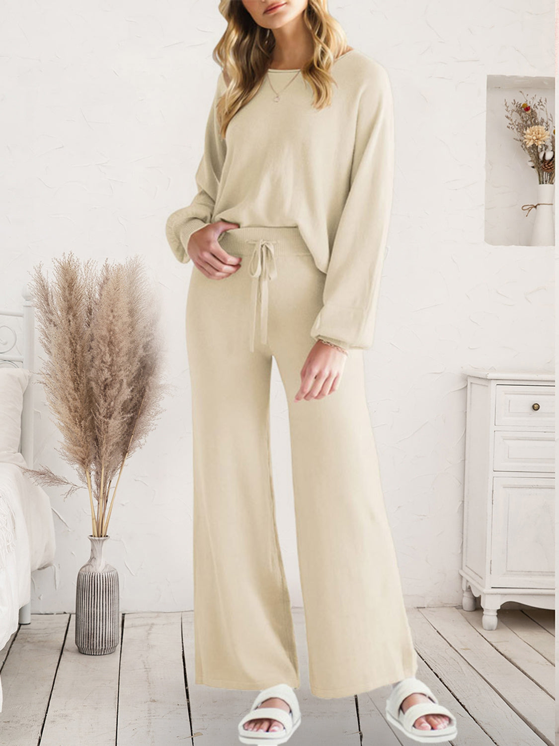 Wide-leg knit loungewear set in ivory with drawstring waist and crew neck top.