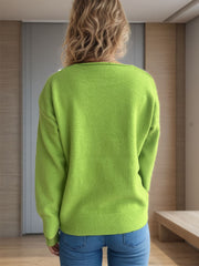 Lime green ribbed hem V-neck knit sweater with long sleeves.