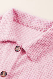 Blush pink waffle knit button-down shirt jacket with brown buttons