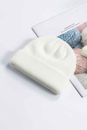 White ribbed knit beanie with a turn-up brim