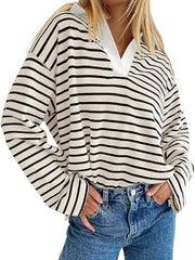 Oversized striped long-sleeve sweatshirt in cream with black horizontal stripes and a white collar.