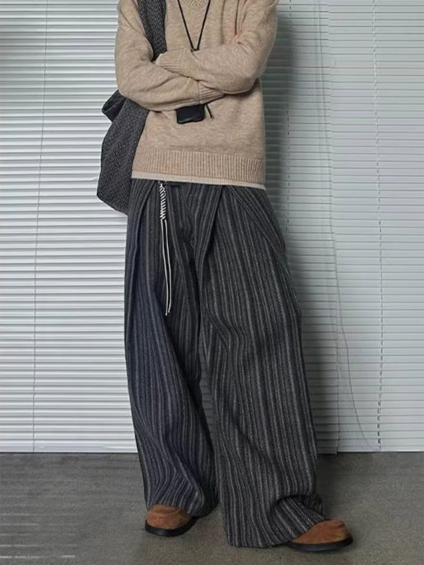 Men's plus size wide leg trousers in black gray stripe with drawstring detail.