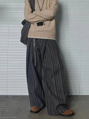 Men's plus size wide leg trousers in black gray stripe with drawstring detail.