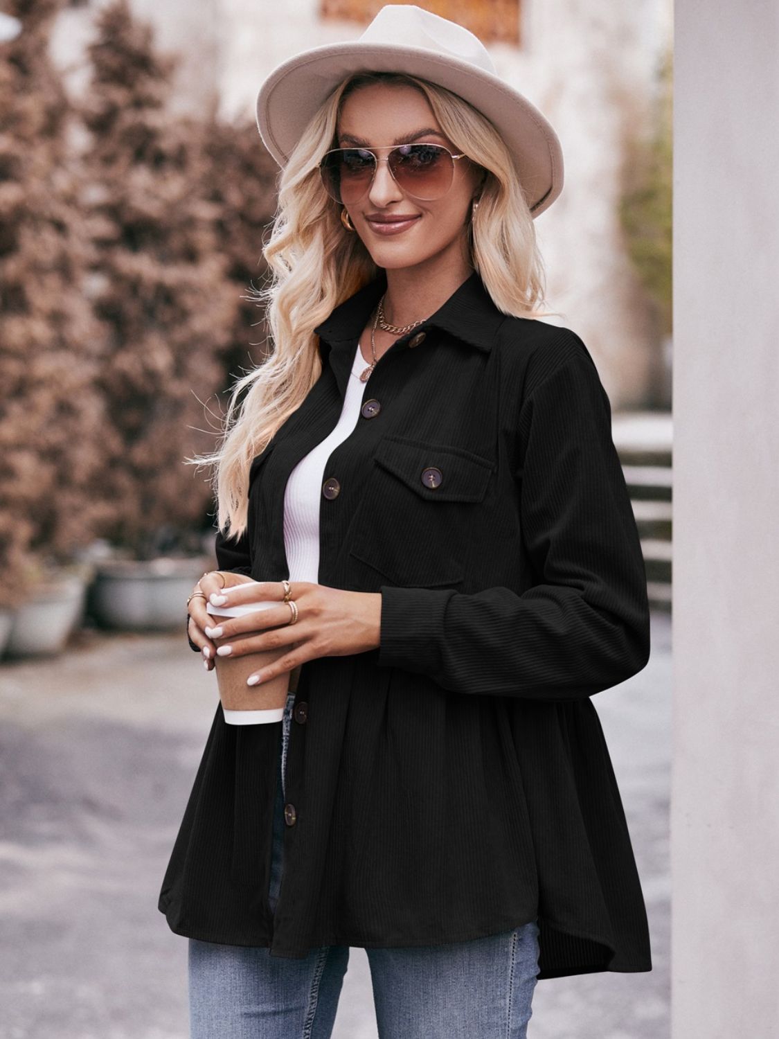 Black corduroy peplum shirt jacket with button front and chest pockets
