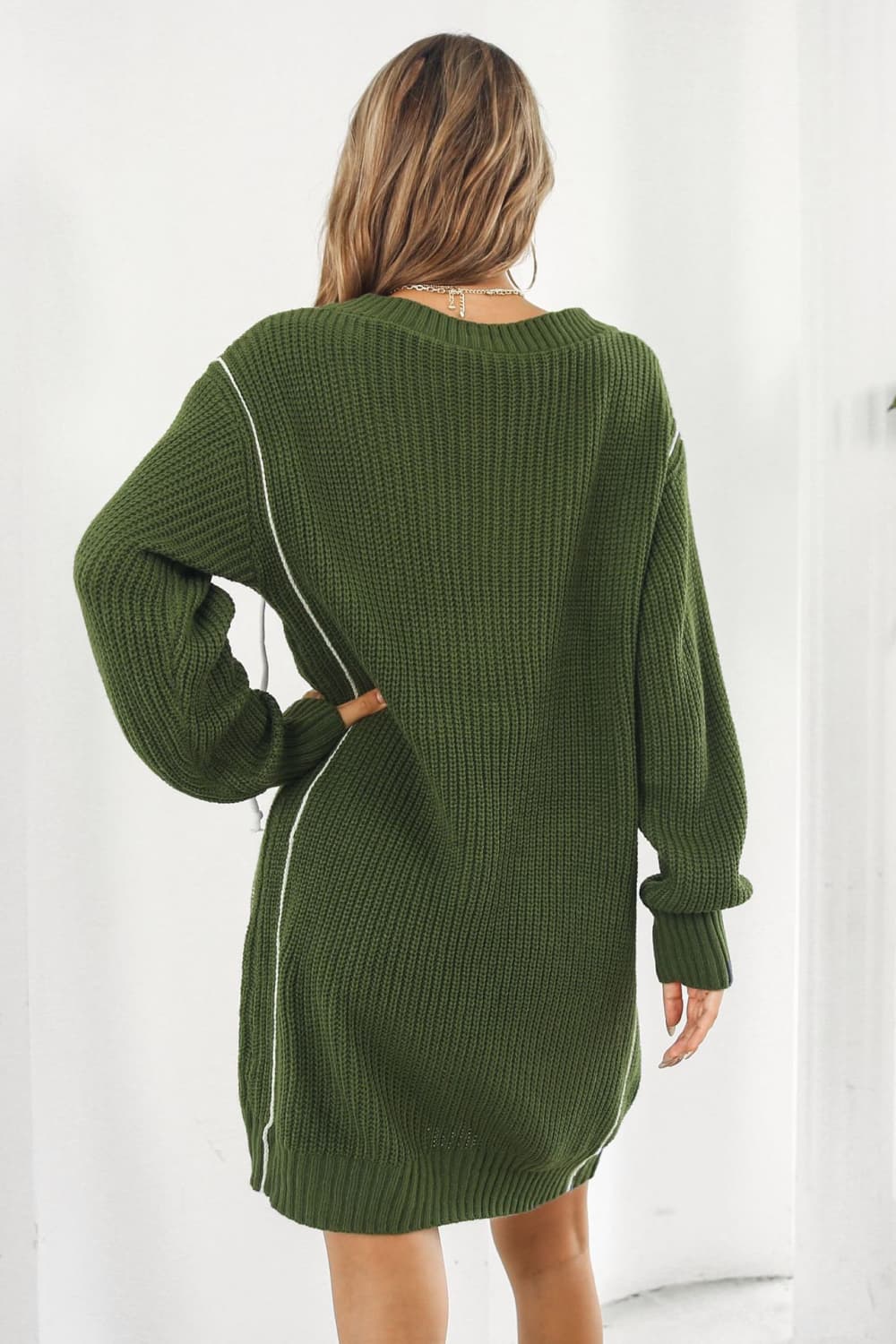 Army green acrylic sweater dress with white stitch detail and V-neck