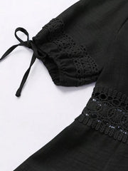 Black mini dress with lace trim and tie sleeves