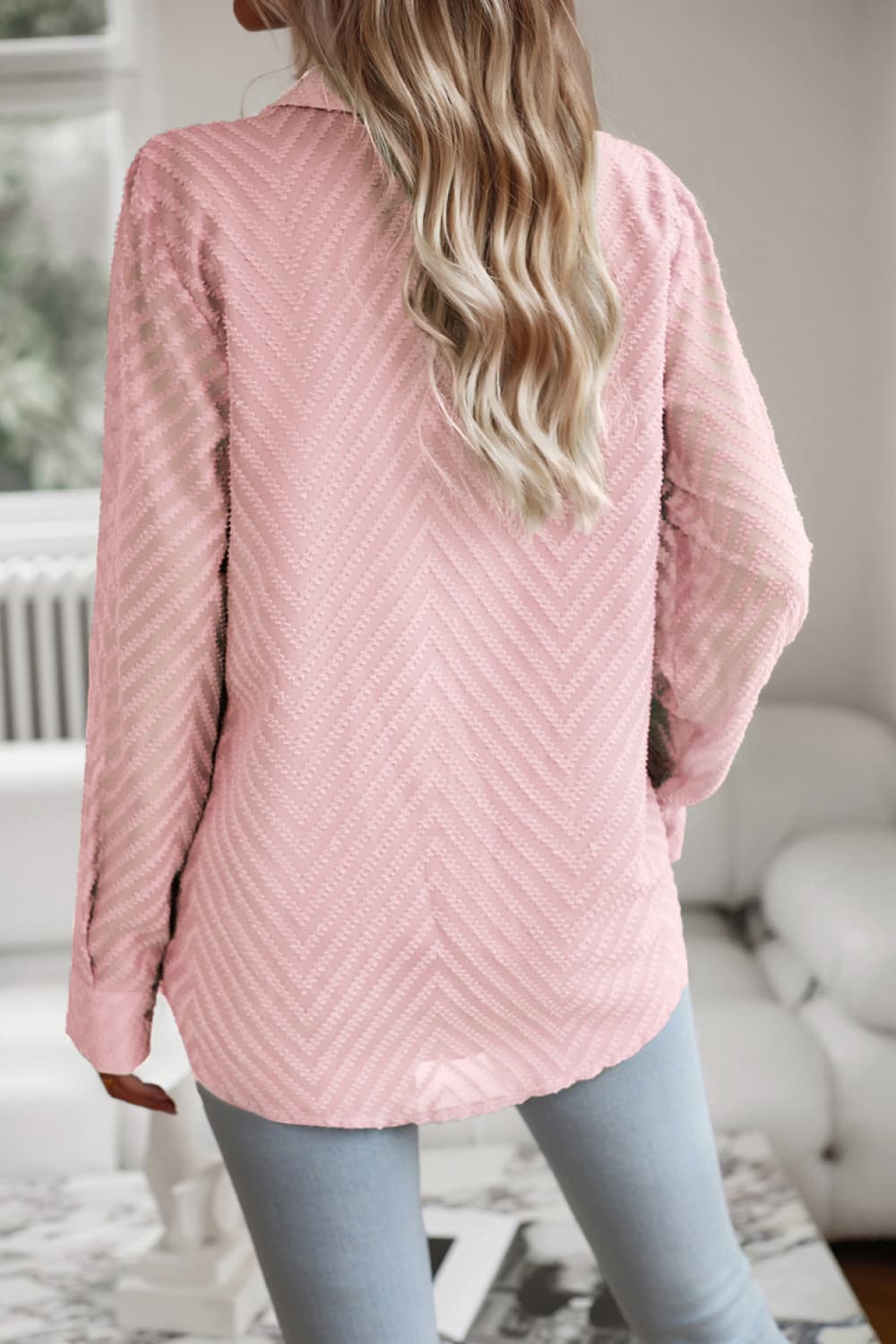 Blush pink textured chevron button-down blouse with long sleeves.