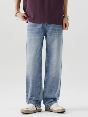 Men's relaxed fit blue washed cotton jeans with a straight leg.