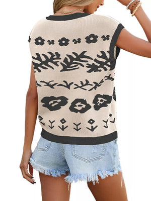 Apricot knit vest with abstract pattern, cap sleeves, and black trim.