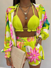 Floral print two-piece outfit set in chartreuse with frill trim bikini top and shorts.