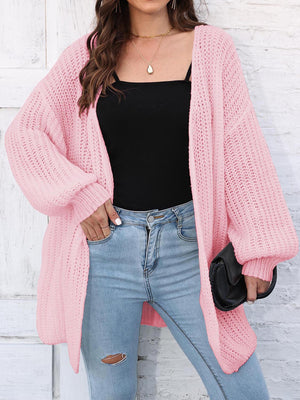 Blush pink open knit cardigan with balloon sleeves and a relaxed fit.