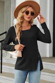 Dark gray asymmetric top with square neck and button detail on the side slit.