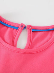 Strawberry cotton dress with keyhole back and blue trim detail.