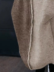 Two-tone hooded knit cardigan in camel and brown acrylic with contrast stitching detail.