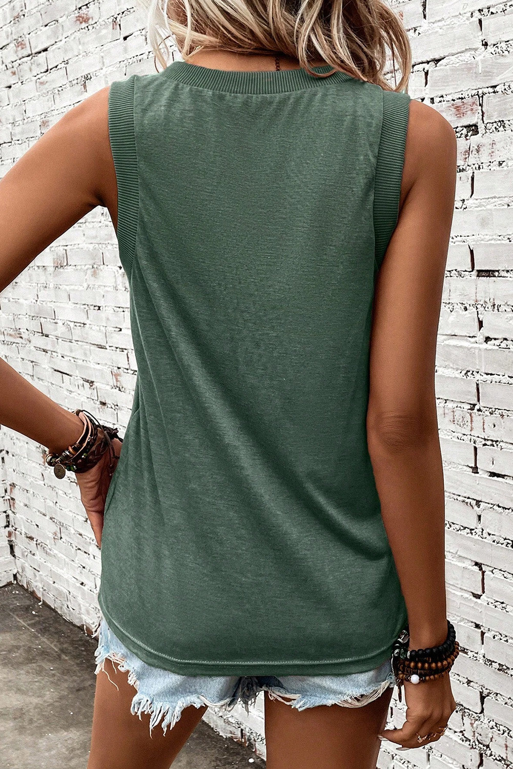 Sage green textured sleeveless V-neck tank top with ribbed neckline and armholes.