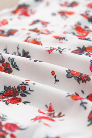 White floral bustier camisole with red and green blooms