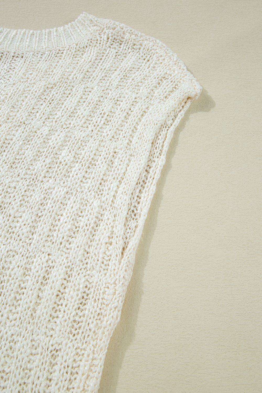 Beige textured knit V-neck shell top with a relaxed fit.
