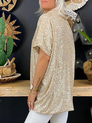 Brass sequin slouchy v-neck top with short sleeves, styled casually.
