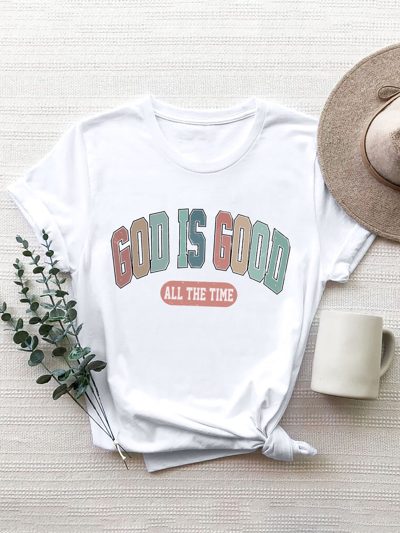 White crewneck t-shirt with "GOD IS GOOD ALL THE TIME" graphic print