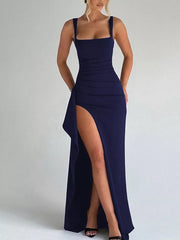 Navy blue ruffled maxi gown with high slit and square neckline.