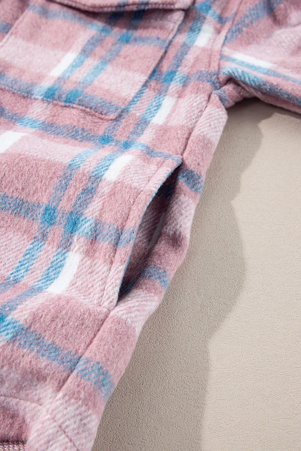 Pastel plaid shacket in dusty pink with a cozy texture and side pocket detail.