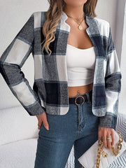 Collarless plaid cropped jacket in dark blue and white, with a casual open front and long sleeves.