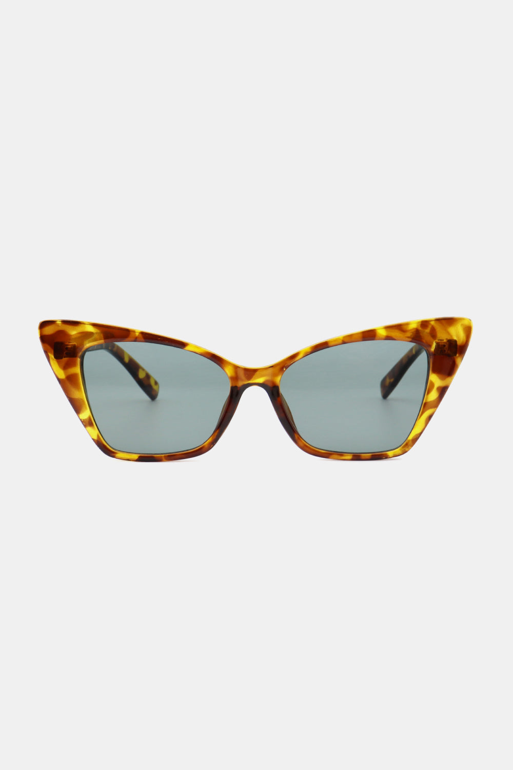 Sharp angular cat-eye sunglasses in tortoise shell acetate with grey lenses.
