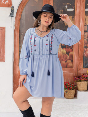 Blue embroidered mini dress with tassels and V-neck, boho style.