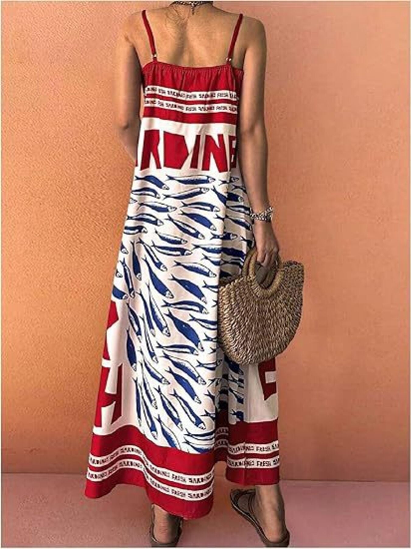 Spaghetti strap maxi dress with blue sardine print and red trim.
