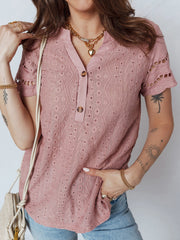 Pink eyelet embroidered short-sleeve blouse with button-down detail and cutout sleeves.