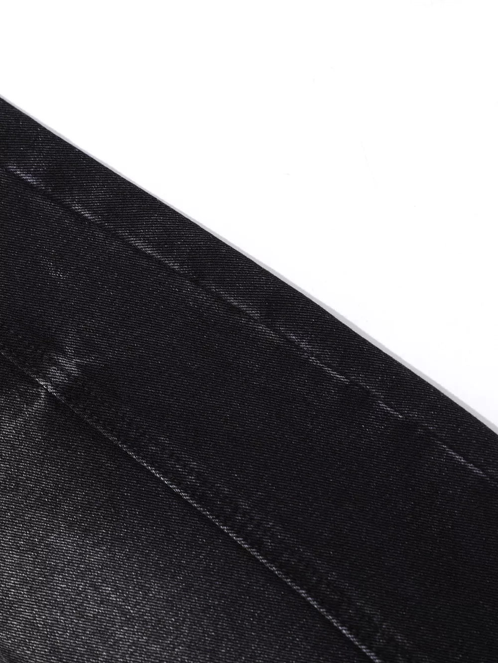 Belted wide leg denim jeans in black cotton with visible stitching detail.