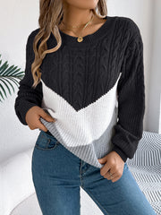 Black chevron cable knit sweater with white and grey colorblock detail.