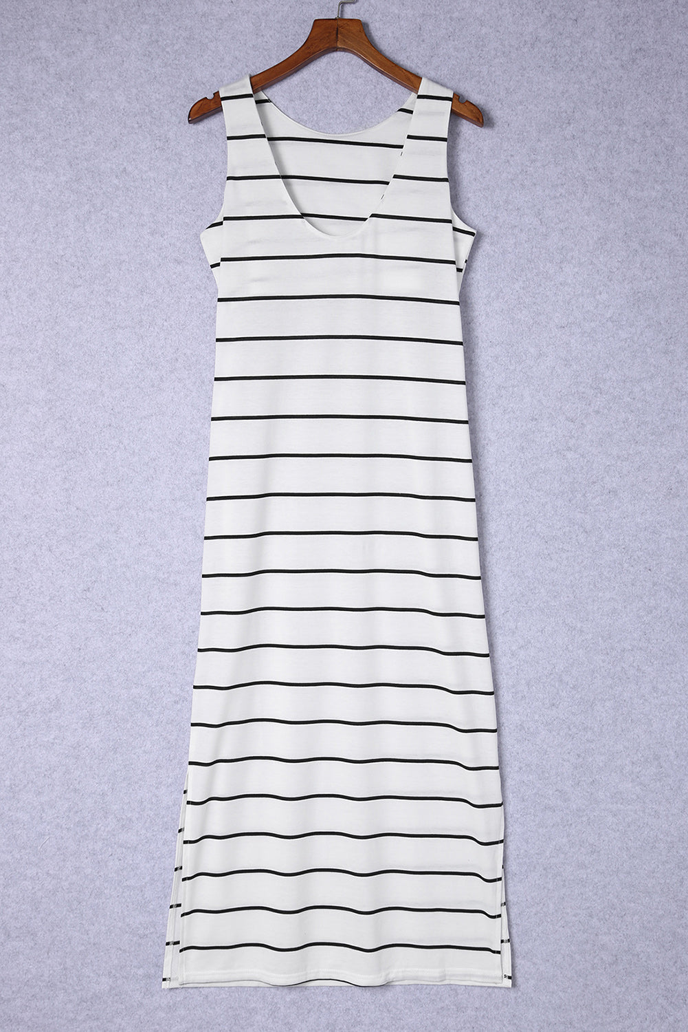 White and black striped maxi dress with a V-neck and side slits.