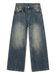 Men's blue baggy fit denim jeans with a faded wash and distressed details.