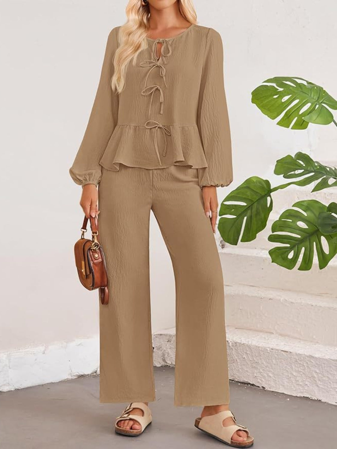 Camel textured peplum tie-neck co-ord set with balloon sleeves and wide-leg pants.