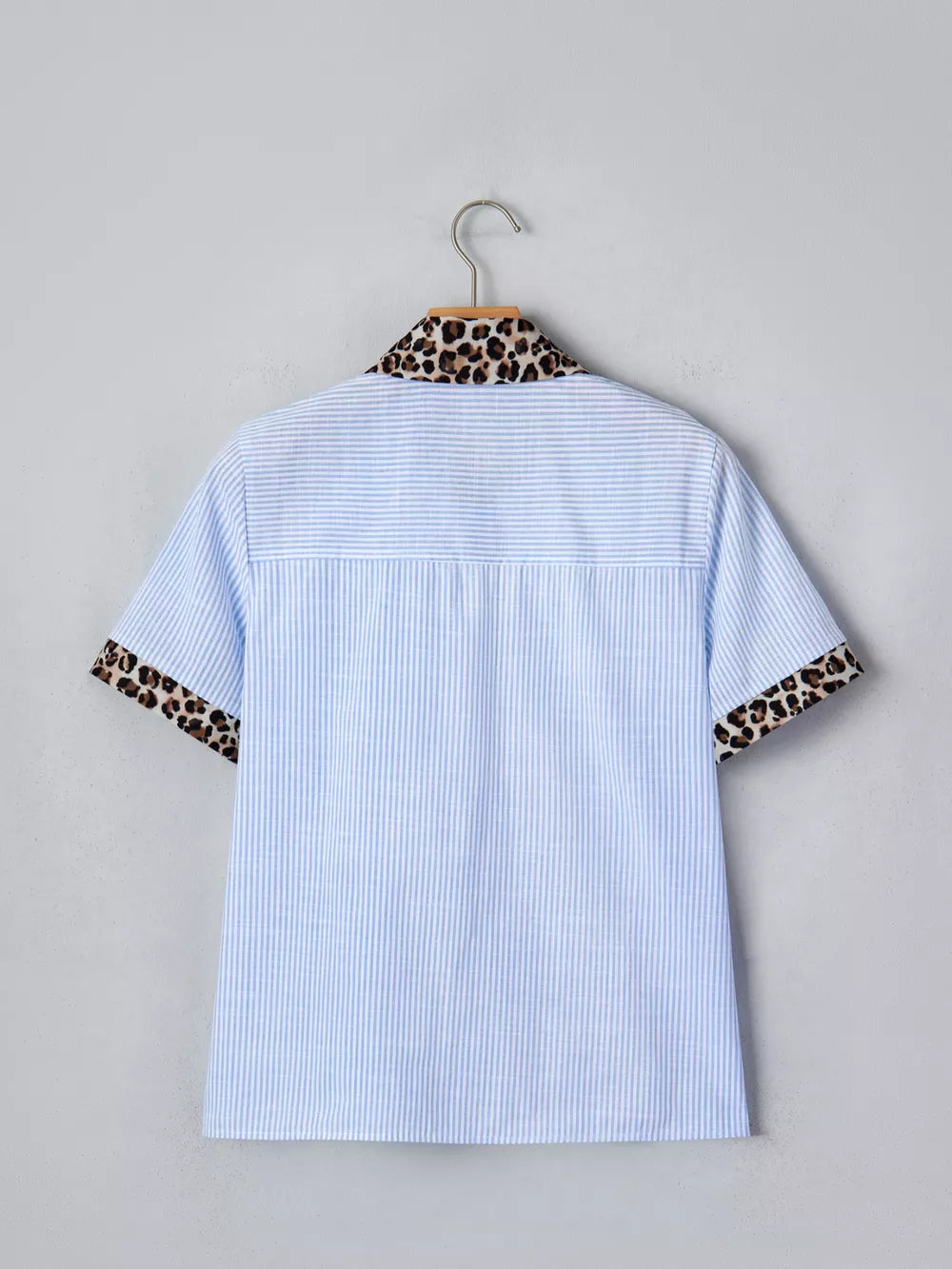 Blue striped button-down shirt with leopard print collar and cuffs