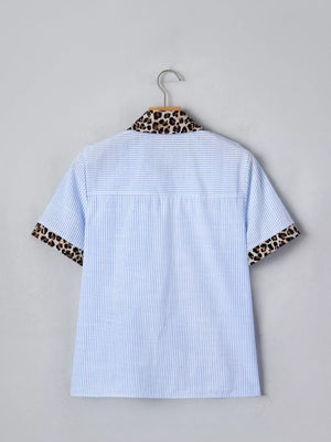 Blue striped button-down shirt with leopard print collar and cuffs