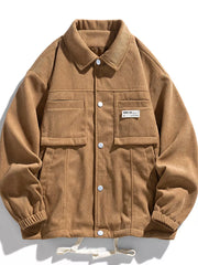 Caramel corduroy button-down jacket with two chest pockets and white buttons.