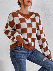Checkerboard knit crewneck pullover sweater in chestnut and white acrylic with crew neck and long sleeves.
