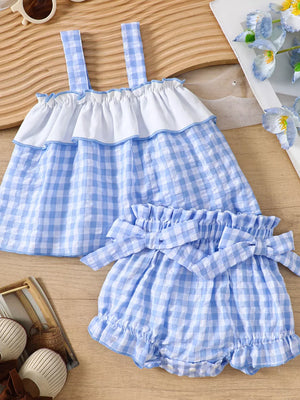 Baby blue gingham ruffle cami and shorts set with white ruffle trim and bow details.